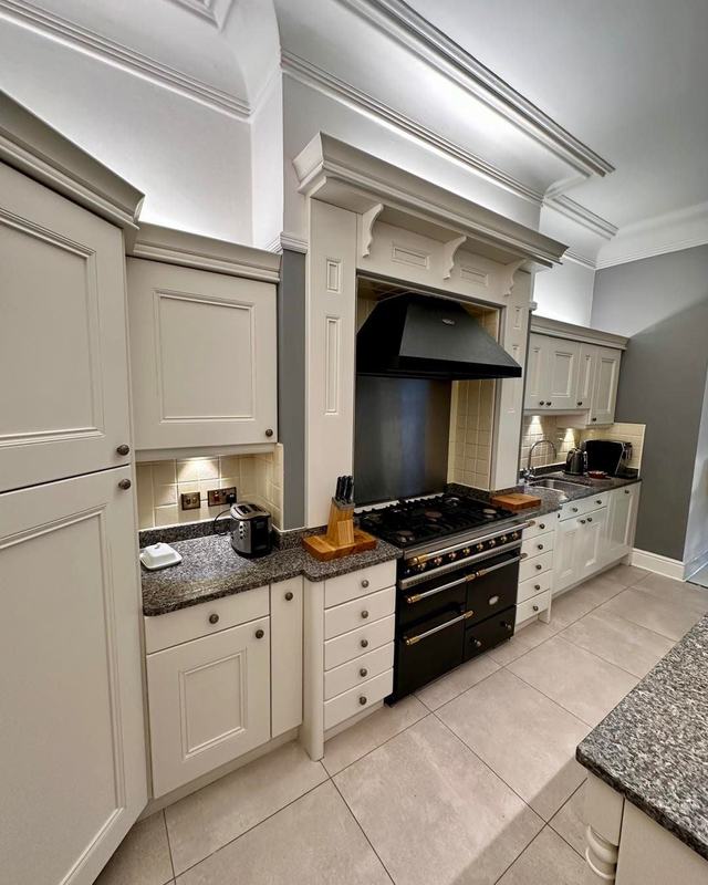 The same kitchen hand painted in soft cream