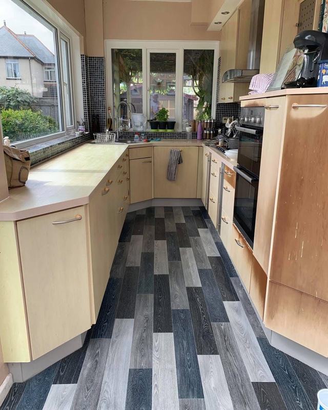 Kitchen with cream painted units and wood worktops