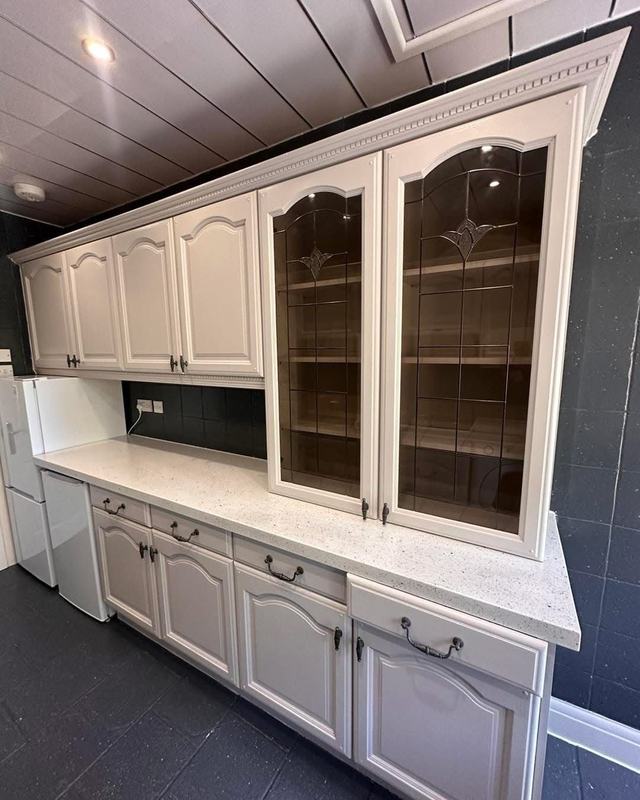 Painted kitchen with glazed display cabinets